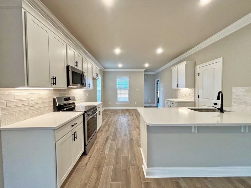 Furnished interior view inside a new home in Natureview, Freeport (Image 11).