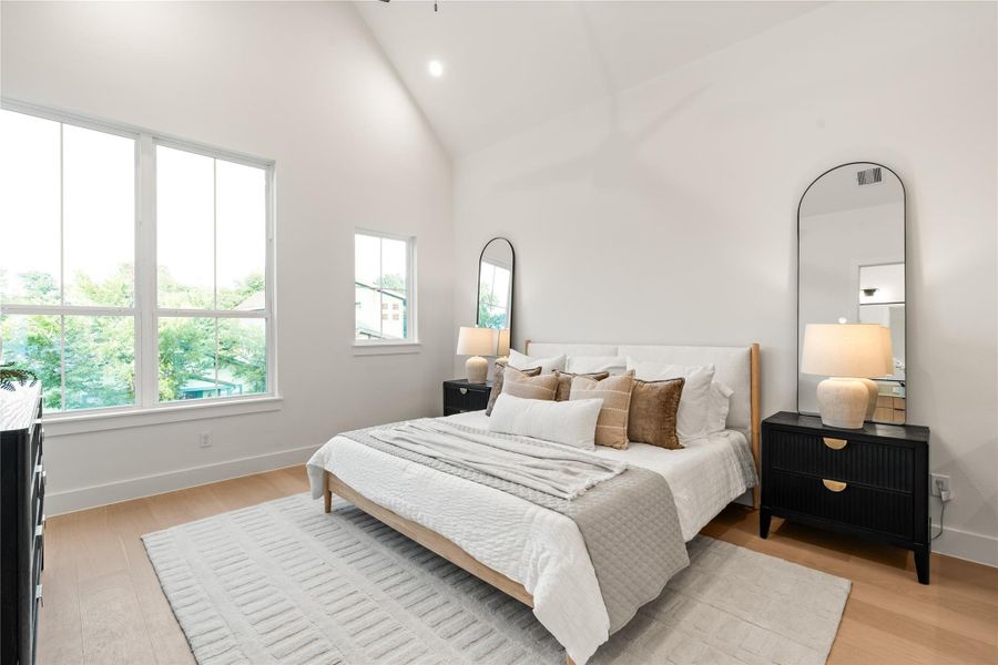 Primary bedroom features soaring cathedral ceilings, two separate large walk-in closets, and a drybar. Primary bedroom features soaring cathedral ceilings, two separate large walk-in closets, and a drybar.