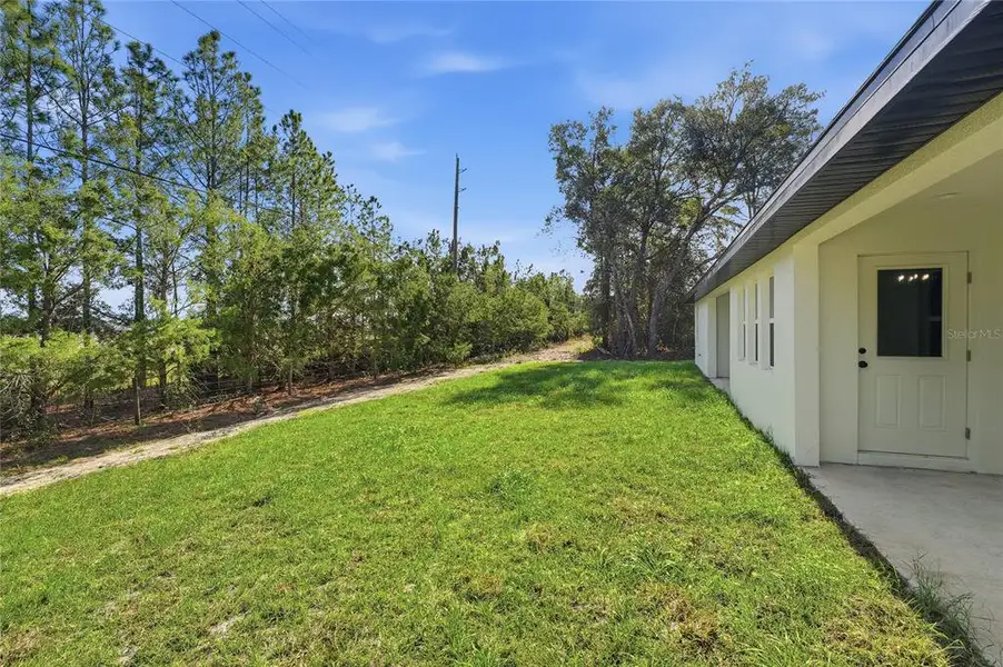Exterior details and patio area of a home in , Ocala (Image 3).