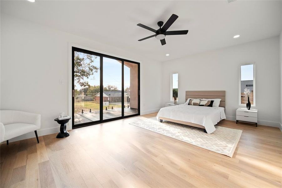 Bedroom featuring ceiling fan, light wood-type flooring, and access to outside