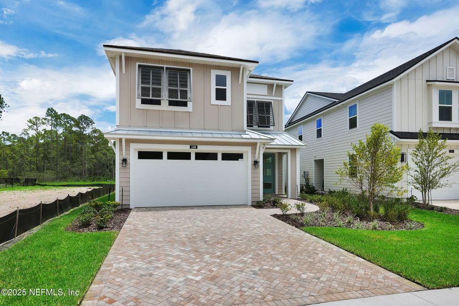 Front exterior of a new home in Reflections at Nocatee, Ponte Vedra, FL, highlighting curb appeal (Image 28).
