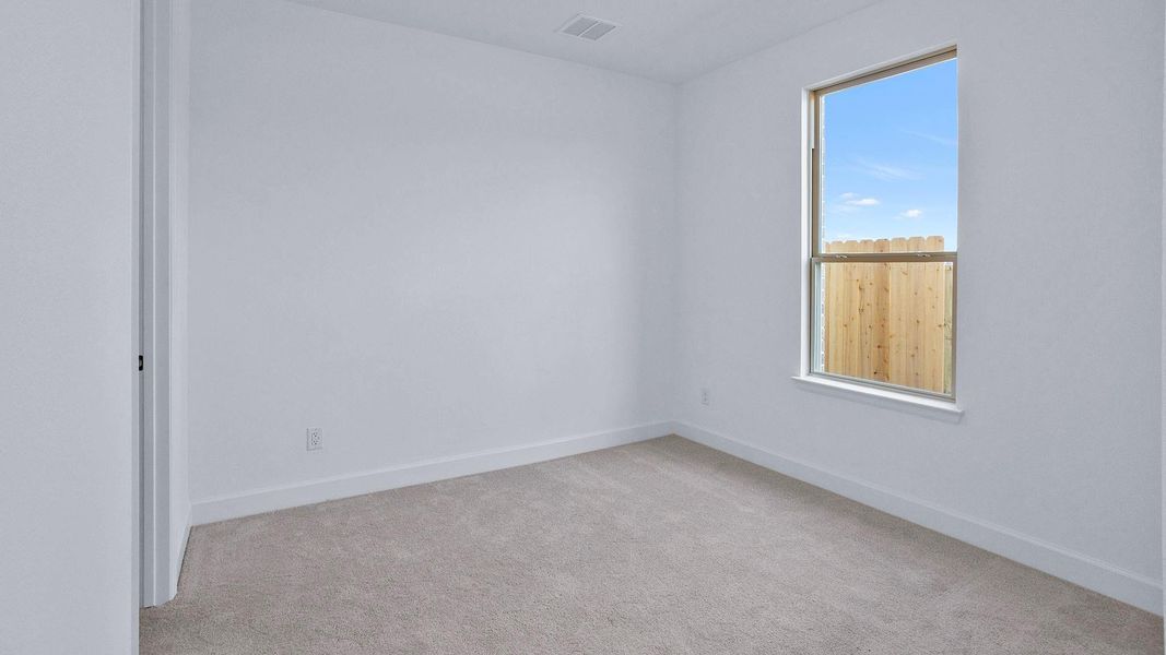 Spacious, unfurnished interior of a new home in Artavia 50', Conroe (Image 13).