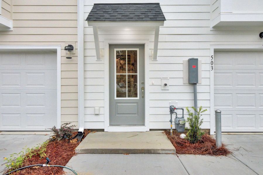 Exterior details and patio area of a home in Indigo Grove Townhomes, Johns Island (Image 2).