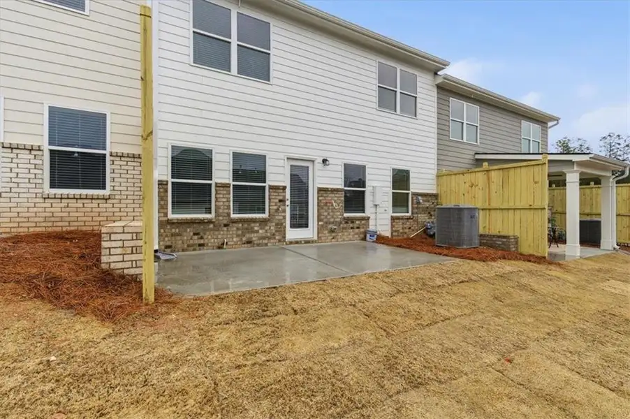 Exterior details and patio area of a home in Park Center Pointe, Mableton (Image 4).