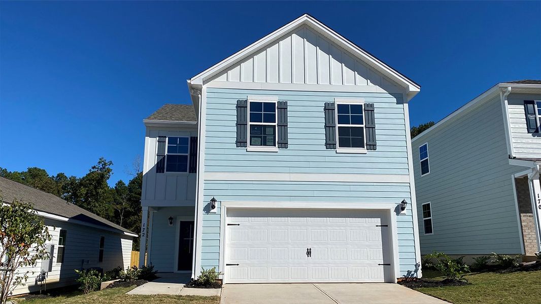 Front exterior of a new home in Livingston Woods, Irmo, SC, highlighting curb appeal (Image 1). Front exterior of a new home in Livingston Woods, Irmo, SC, highlighting curb appeal (Image 1).
