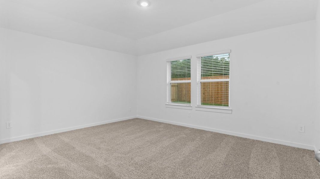 Spacious, unfurnished interior of a new home in Caldwell Crossing, Iowa Colony (Image 15).