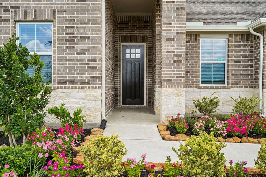 Stunning landscaping leading up to the front door Stunning landscaping leading up to the front door