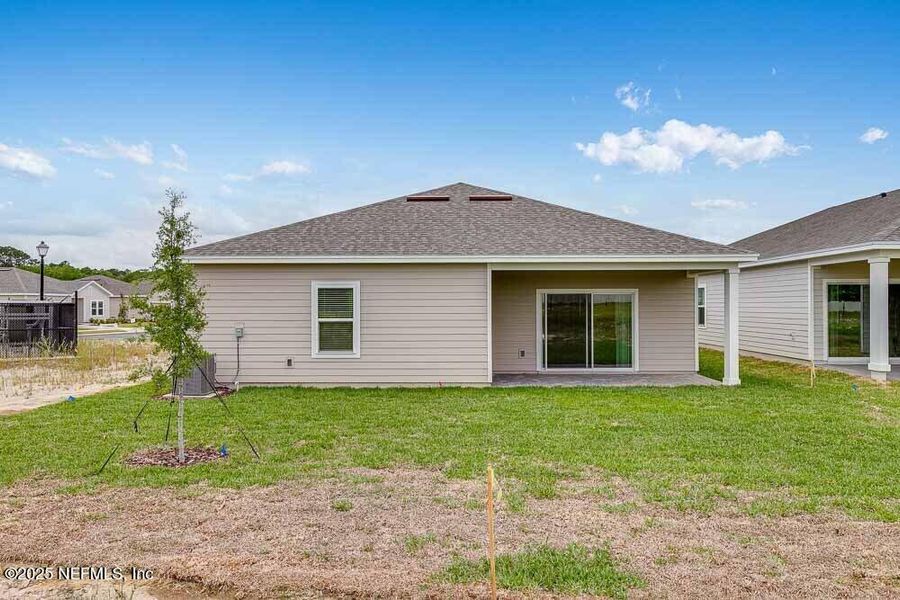Front exterior of a new home in Coopers Meadow, Jacksonville, FL, highlighting curb appeal (Image 20).