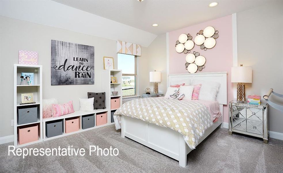 Bedroom featuring carpet and lofted ceiling