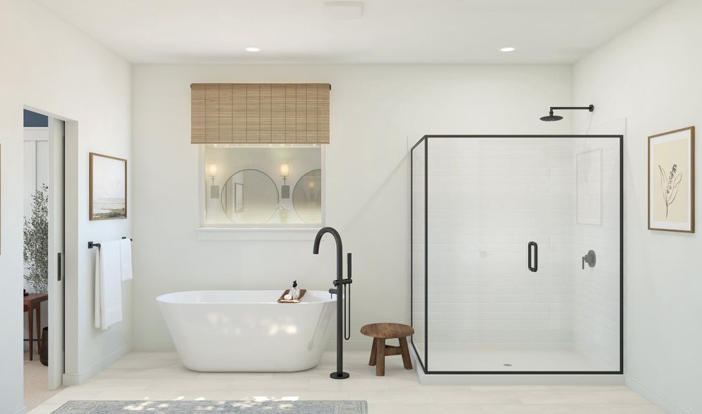 Primary bath with freestanding tub and glass shower enclosure