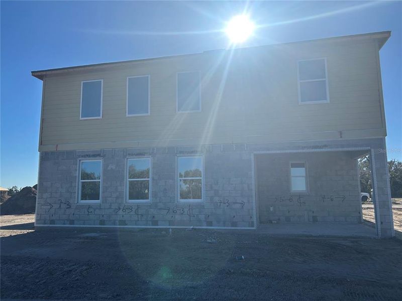 Exterior details and patio area of a home in Oakfield Trails, Parrish (Image 3).