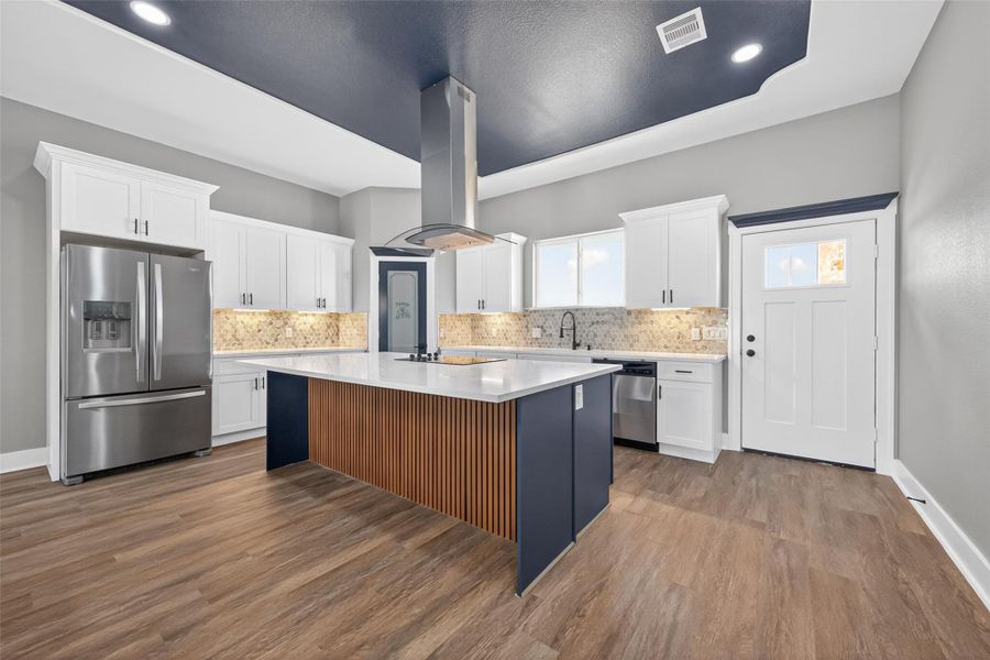 Custom kitchen with extensive cabinetry, ample counter space, and a functional layout. Custom kitchen with extensive cabinetry, ample counter space, and a functional layout.