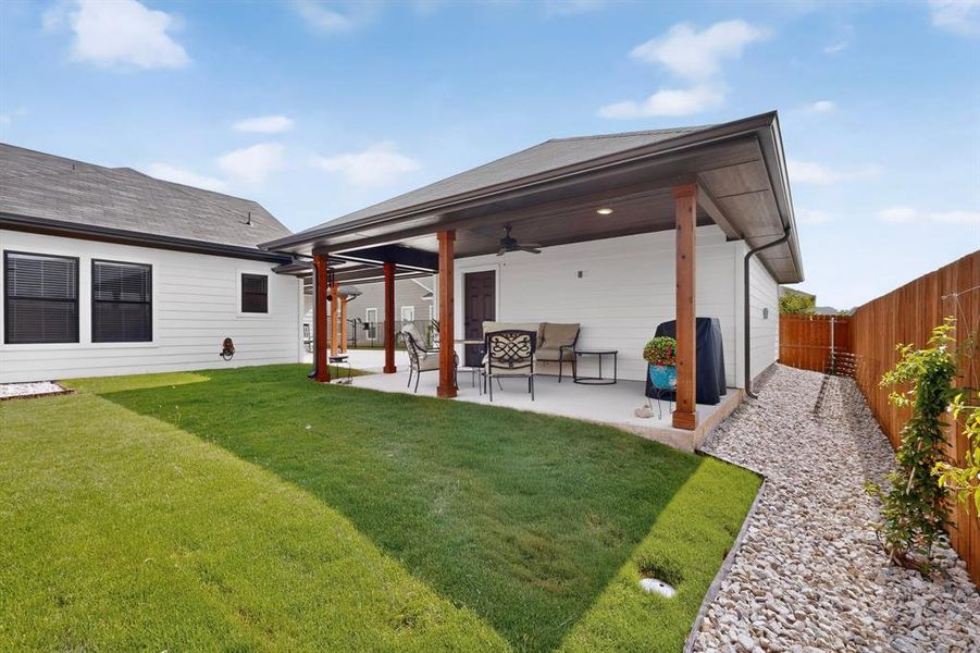 Rock garden surrounds the detached garage for low maintenance living