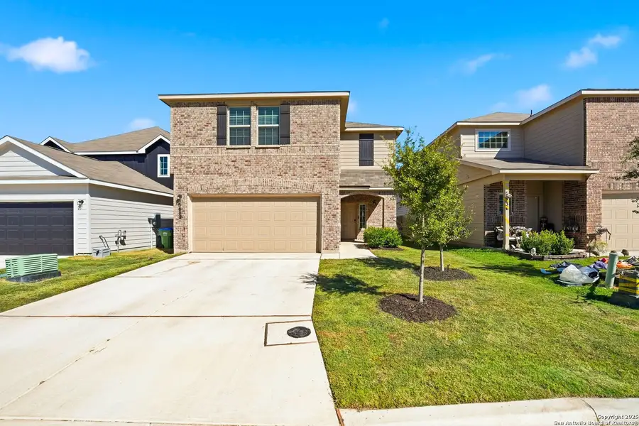 Front exterior of a new home in Abbott Place, St. Hedwig, TX, highlighting curb appeal (Image 2).