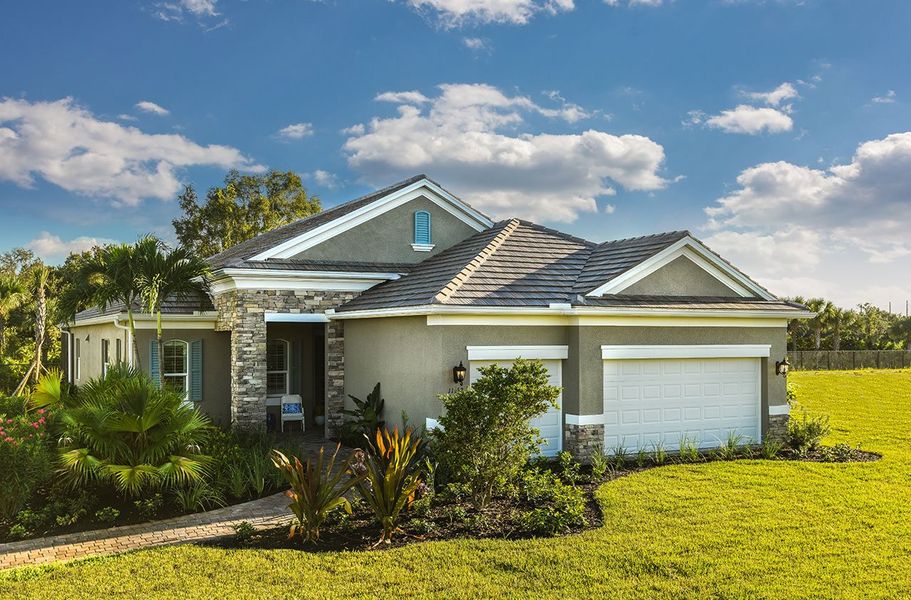 Representative exterior photo of a completed home built from the Sea Star by Neal Communities in Verandah, Fort Myers, FL (Image 1). Representative exterior photo of a completed home built from the Sea Star by Neal Communities in Verandah, Fort Myers, FL (Image 1).