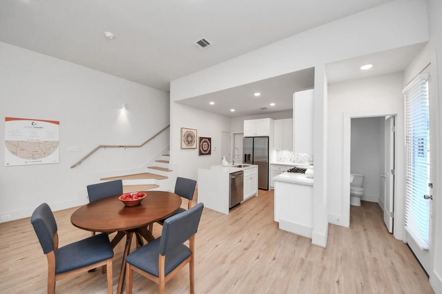 Kitchen flows into the dining area, perfect for entertaining. Kitchen flows into the dining area, perfect for entertaining.