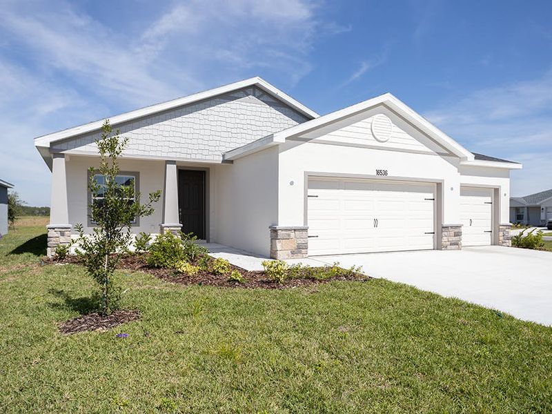 A beautiful craftsman-style exterior welcomes you home to the Summerlyn II by Highland Homes!