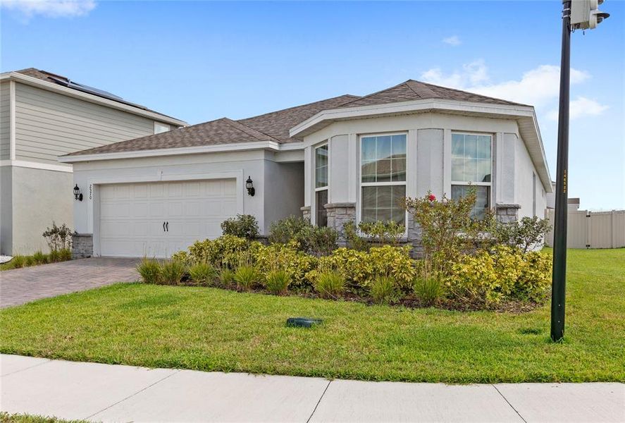 Front exterior of a new home in , Kissimmee, FL, highlighting curb appeal (Image 24). Front exterior of a new home in , Kissimmee, FL, highlighting curb appeal (Image 24).