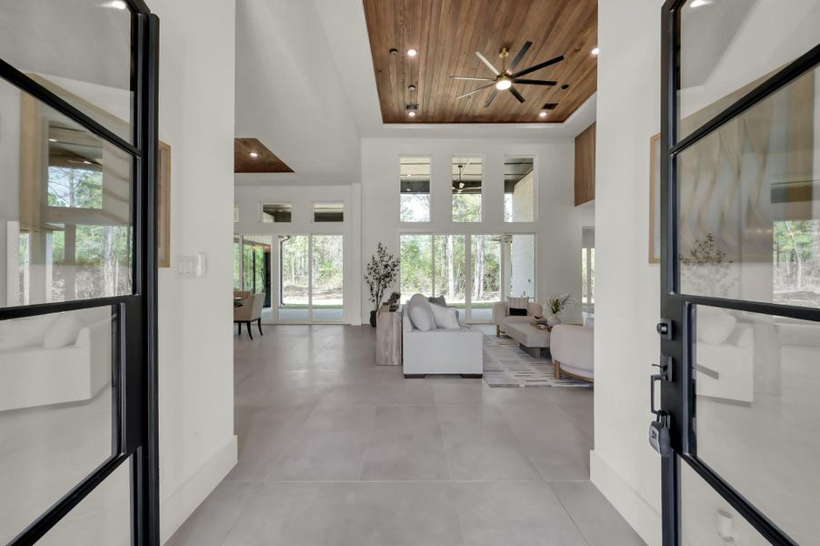 Step inside to a light-filled foyer where clean lines, soft neutral tones, and expansive sightlines immediately connect you to the home’s refined yet relaxed aesthetic.