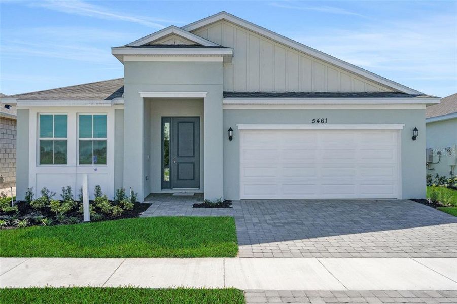 Front exterior of a new home in Brystol North at Wylder, Port St. Lucie, FL, highlighting curb appeal (Image 1). Front exterior of a new home in Brystol North at Wylder, Port St. Lucie, FL, highlighting curb appeal (Image 1).