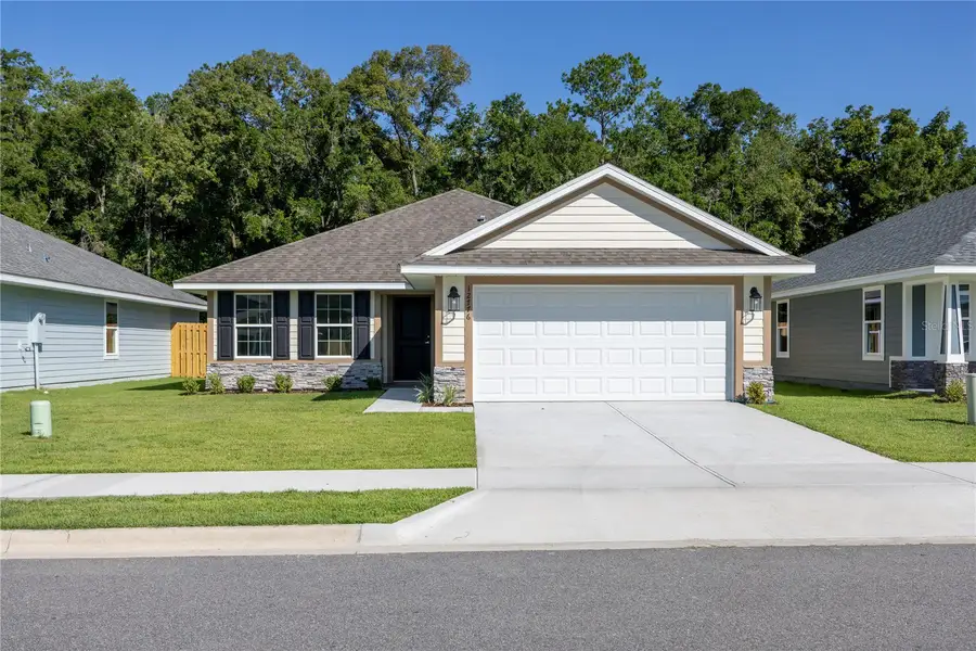 Front exterior of a new home in Kirkland Farms, Alachua, FL, highlighting curb appeal (Image 1). Front exterior of a new home in Kirkland Farms, Alachua, FL, highlighting curb appeal (Image 1).