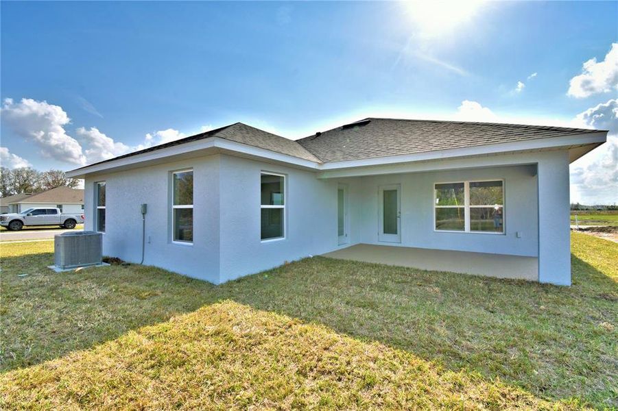 Exterior details and patio area of a home in Cadence Crossing, Auburndale (Image 28).