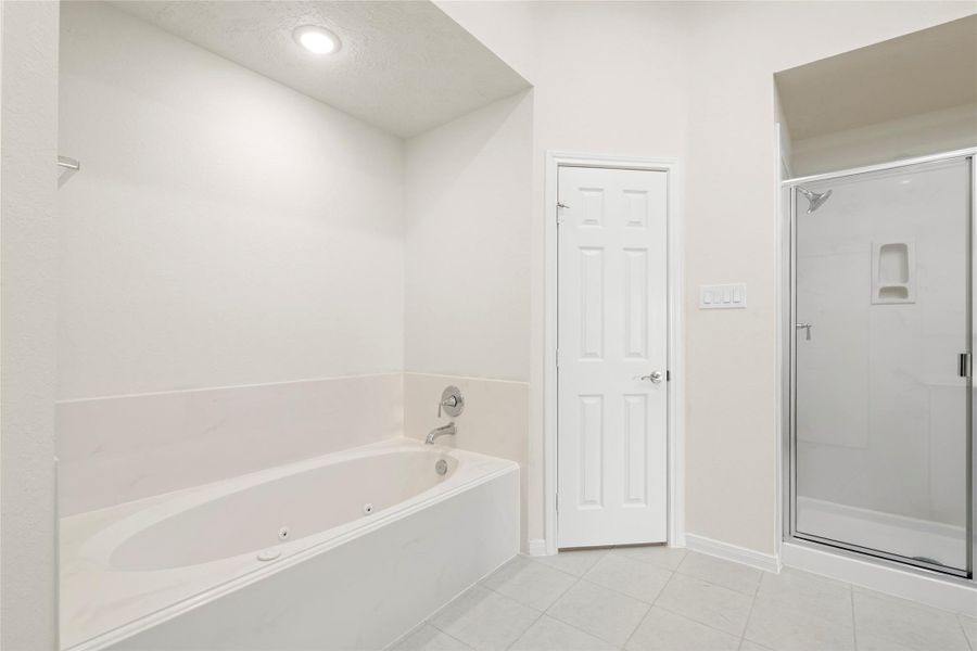 Unwind in the oversized jetted soaking tub or refresh in the separate expanded-size walk-in shower. The thoughtful separation of the tub and shower maximizes both space and function, offering a spa-like versatility rarely found at this price point. Unwind in the oversized jetted soaking tub or refresh in the separate expanded-size walk-in shower. The thoughtful separation of the tub and shower maximizes both space and function, offering a spa-like versatility rarely found at this price point.
