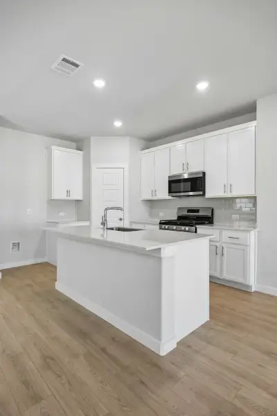Kitchen in the Birch home plan by Trophy Signature Homes – REPRESENTATIVE PHOTO Kitchen in the Birch home plan by Trophy Signature Homes – REPRESENTATIVE PHOTO