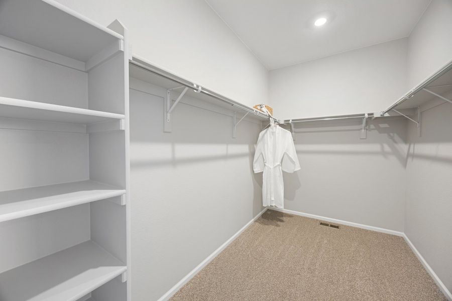 Representative unfurnished interior of a home built from the 2504 by Risewell Homes in Harvest Crossing, Aurora (Image 20).
