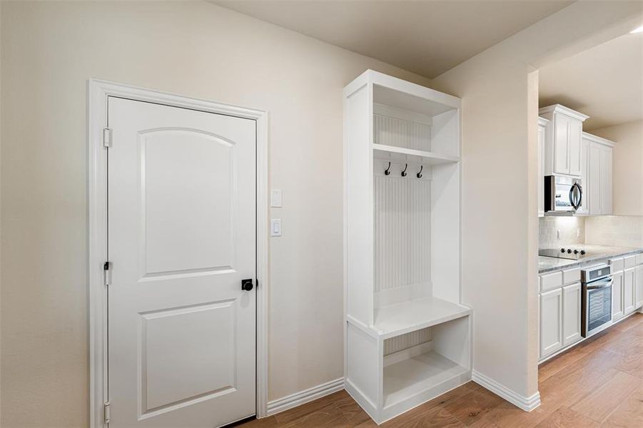 Mudroom featuring light wood-style flooring