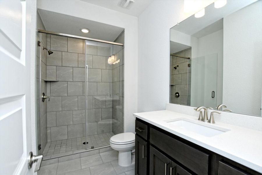 Representative furnished interior of a home built from the Madera II by Giddens Homes in Scofield Farms Estates, Georgetown (Image 284).