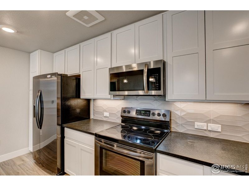 Furnished interior view inside a new home in Highlands at Fox Hill - The Flats, Longmont (Image 8).