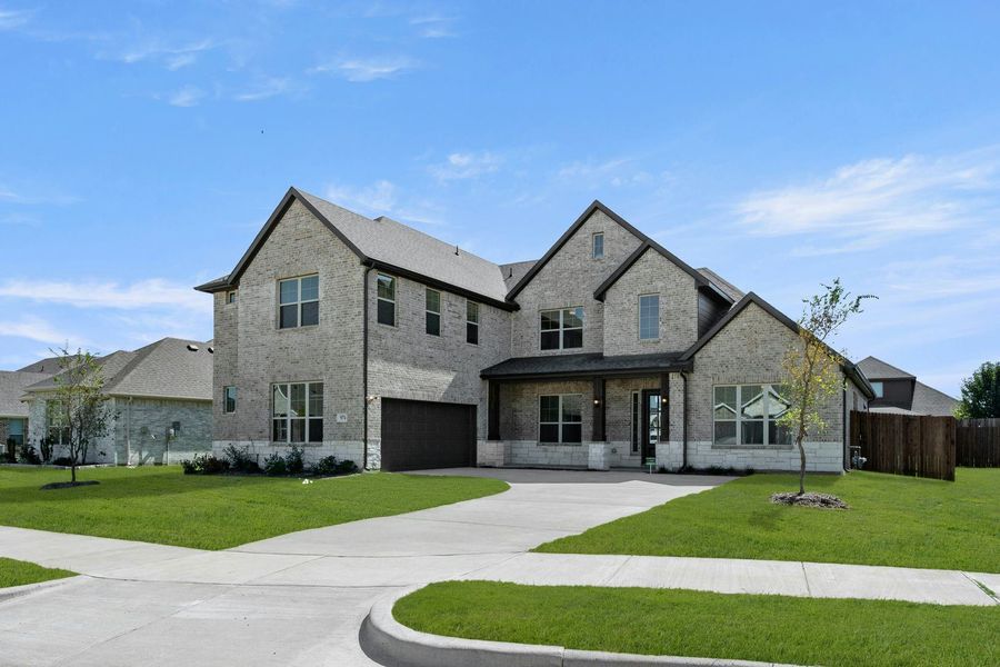 Front exterior of a new home in Kentsdale Farms, DeSoto, TX, highlighting curb appeal (Image 2). Front exterior of a new home in Kentsdale Farms, DeSoto, TX, highlighting curb appeal (Image 2).