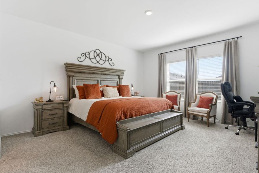 Spacious primary bedroom located on the first floor for comfort and privacy. Spacious primary bedroom located on the first floor for comfort and privacy.