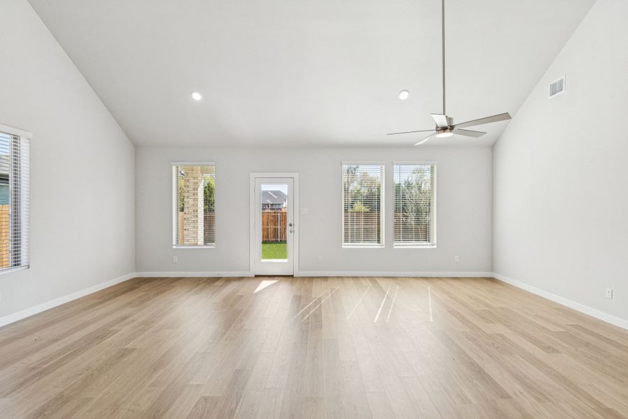 Dining and Living Rooms in the Winters home plan by Trophy Signature Homes – REPRESENTATIVE PHOTO