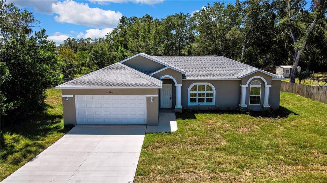 Front exterior of a new home in , Brooksville, FL, highlighting curb appeal (Image 18).