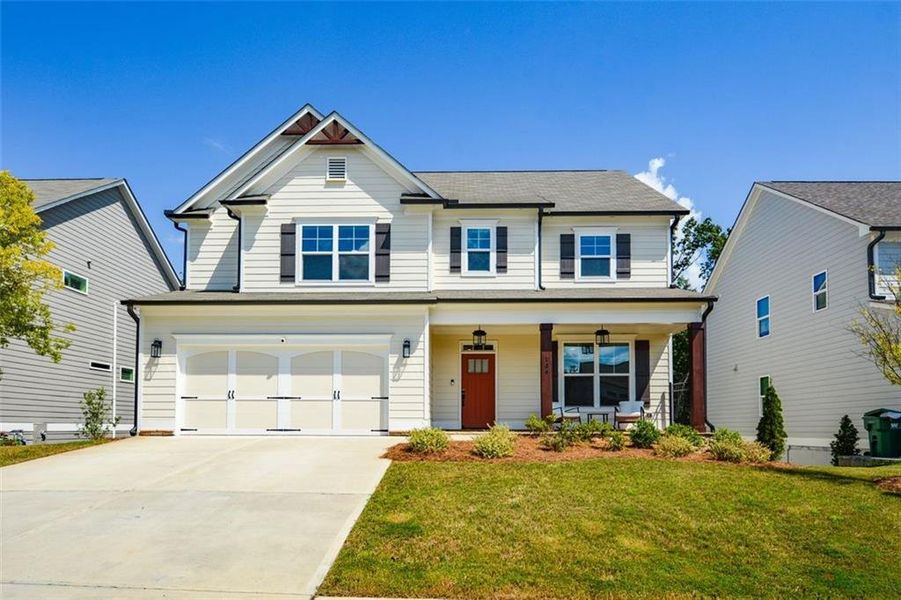 Front exterior of a new home in , Woodstock, GA, highlighting curb appeal (Image 24).