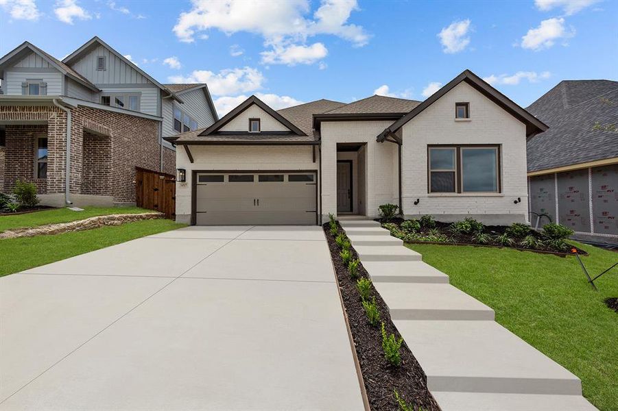 Front exterior of a new home in Walsh Classic, Aledo, TX, highlighting curb appeal (Image 1). Front exterior of a new home in Walsh Classic, Aledo, TX, highlighting curb appeal (Image 1).
