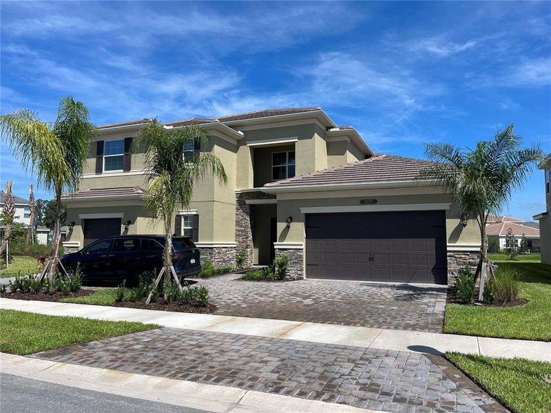 Front exterior of a new home in , Wesley Chapel, FL, highlighting curb appeal (Image 2).