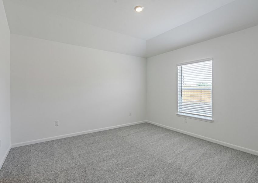 Master bedroom with a large window and ceiling fan light fixture