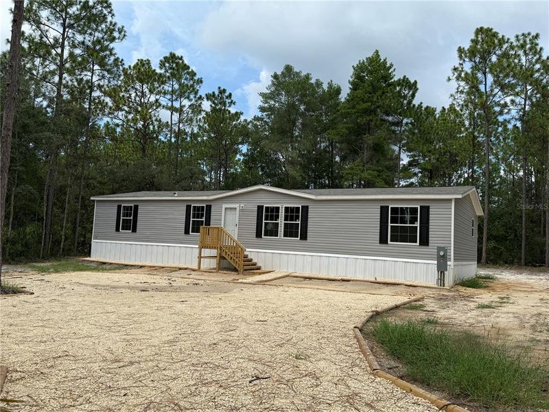 Front exterior of a new home in , Crystal River, FL, highlighting curb appeal (Image 2).