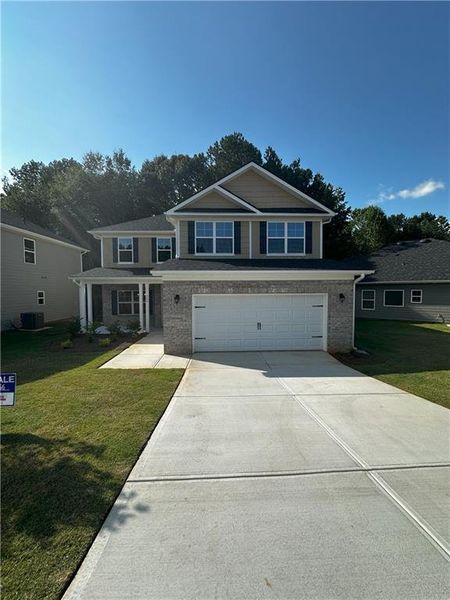 Front exterior of a new home in Canterbury Villas, Carrollton, GA, highlighting curb appeal (Image 21).