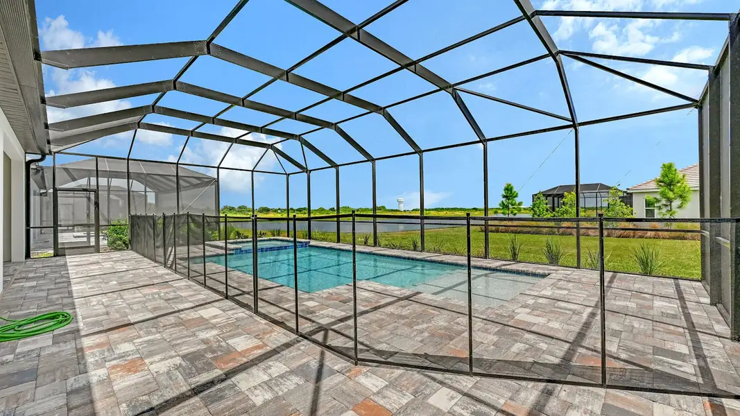 Exterior details and patio area of a home in Palm Grove Real Estate and Homes for Sale in Lakewood Ranch, FL - Neal Communities, Bradenton (Image 19).