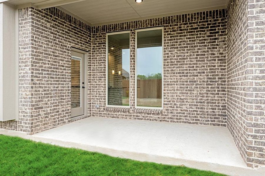 Exterior details and patio area of a home in The Oaks, Red Oak (Image 23). Exterior details and patio area of a home in The Oaks, Red Oak (Image 23).