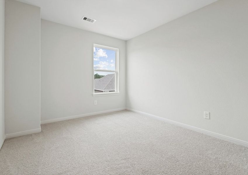 Bedroom with lush carpet flooring Bedroom with lush carpet flooring