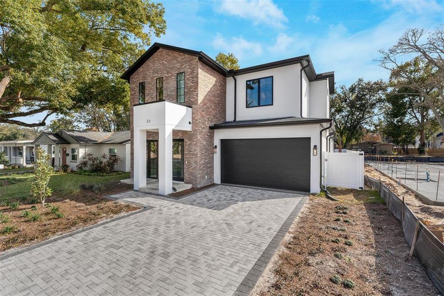 Front exterior of a new home in College Park, Orlando, FL, highlighting curb appeal (Image 2). Front exterior of a new home in College Park, Orlando, FL, highlighting curb appeal (Image 2).