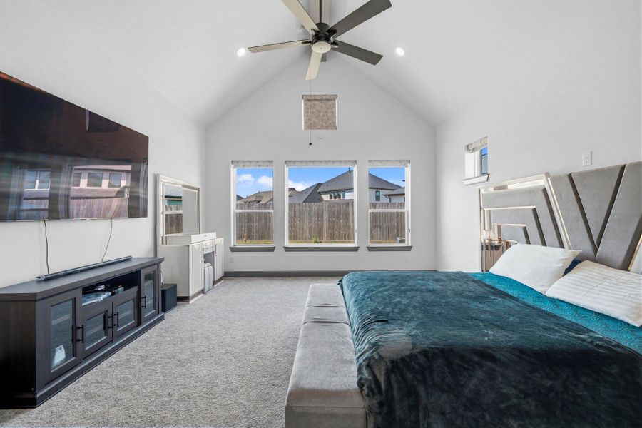 Luxurious primary retreat with vaulted ceilings and generous space for comfort and style.