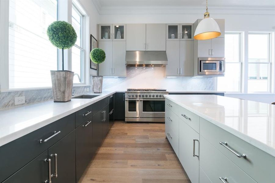 Ease of movement in this kitchen with plenty of counterspace and what a great focal point with the Fisher & Paykel range!