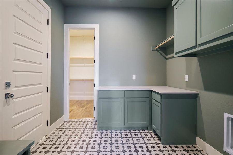 Laundry room with cabinets