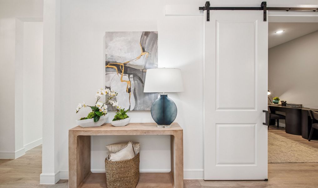 Foyer with sliding barn door to home office